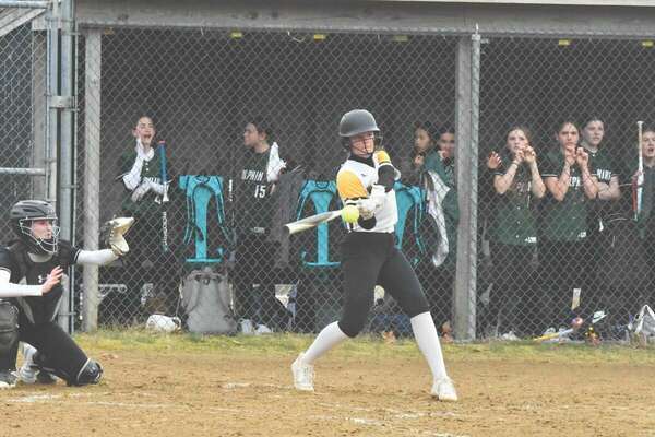Junior Lila Alger connects for a base hit.