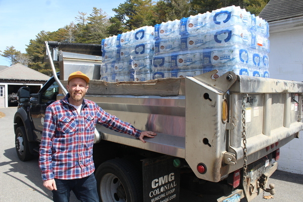 Water Superintendent Dan Pelletier helps coordinate the distribution of bottled water to North Harwich residents. WILLIAM F. GALVIN PHOTO