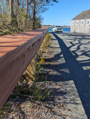 The guardrail, built legally by an abutter to the Sears Road town landing, reduced the number of available parking spaces there. ALAN POLLOCK PHOTO