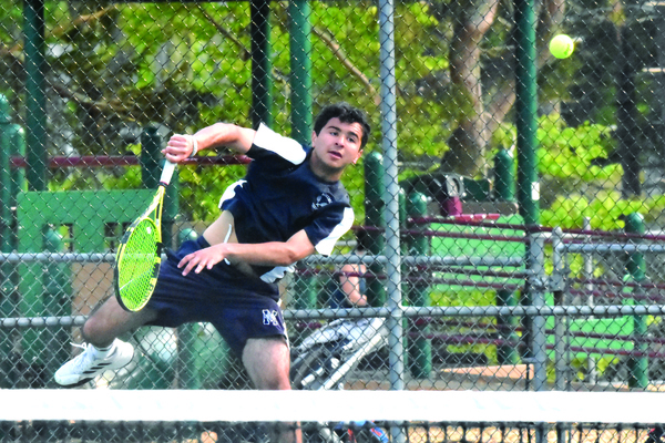 Monomoy junior Ryan Casey, seen here serving during a match last season, has been leading the Sharks while competing as the team’s top singles player. FILE PHOTOS