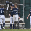 Monomoy juniors Casey Huse (22) and Chase Yarletts (4) high five after Yarletts scored a run during Monomoy’s 10-0 victory over Cape Cod Tech on Monday at Whitehouse Field in Harwich. BRAD JOYAL PHOTOS