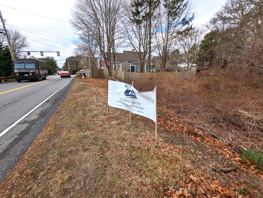 The conceptual plan favored by the affordable housing trust seeks to develop the southern half of the former Marceline land, with access somewhere near this banner on Queen Anne Road. ALAN POLLOCK PHOTO