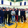 The Monomoy boys soccer team poses for a photo during a halftime ceremony celebrating the team’s state championship appearance. The team was awarded a plaque that will be displayed in the school’s trophy case. BRAD JOYAL PHOTOS